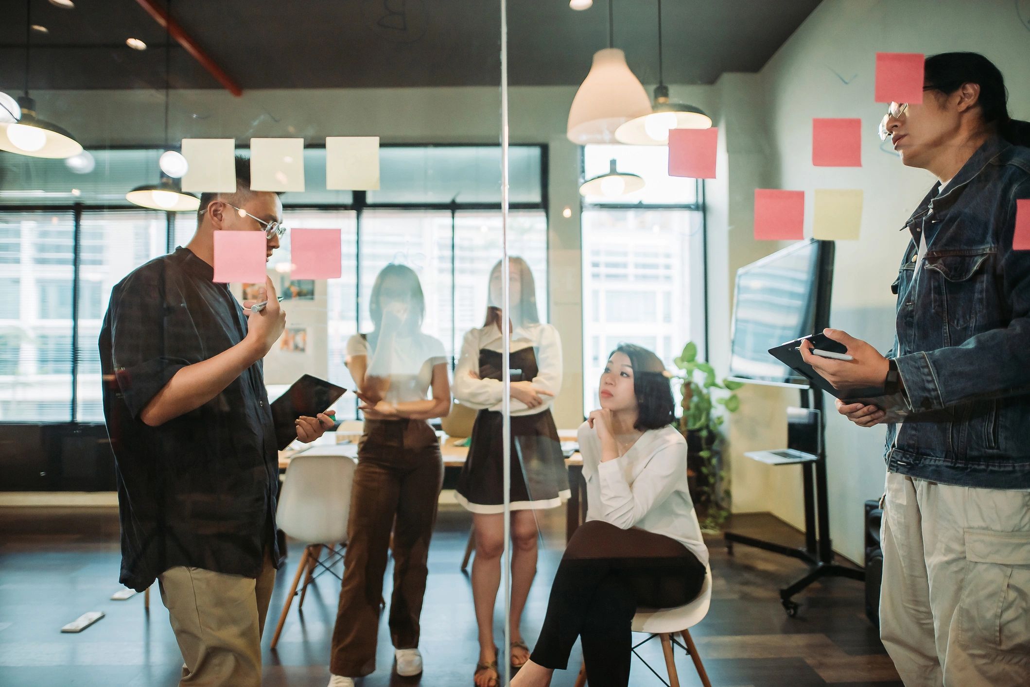 Colleagues in an office discussing a presentation