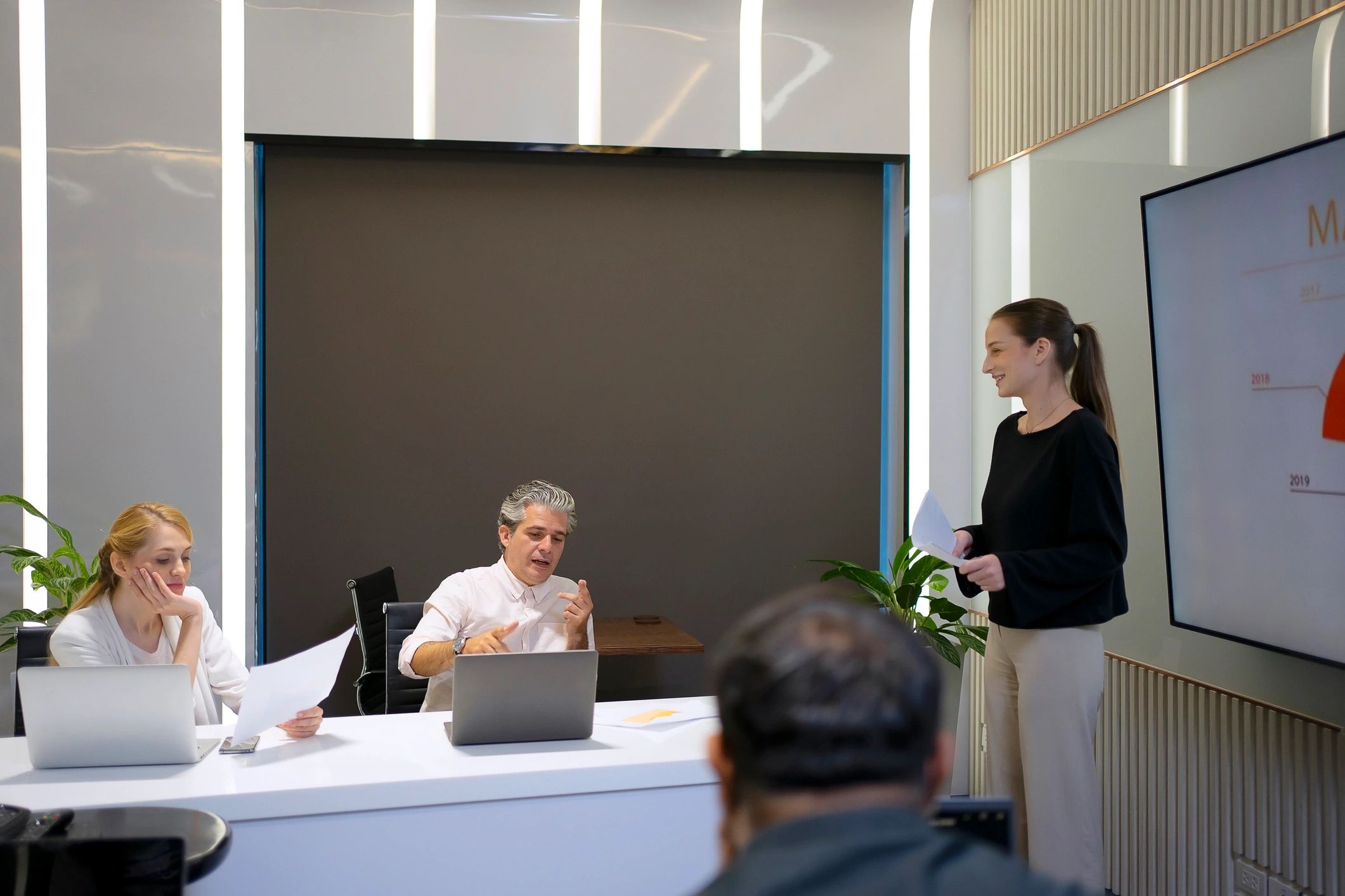 Indian colleagues collaborating in a meeting room during a facilitator-led workplace session